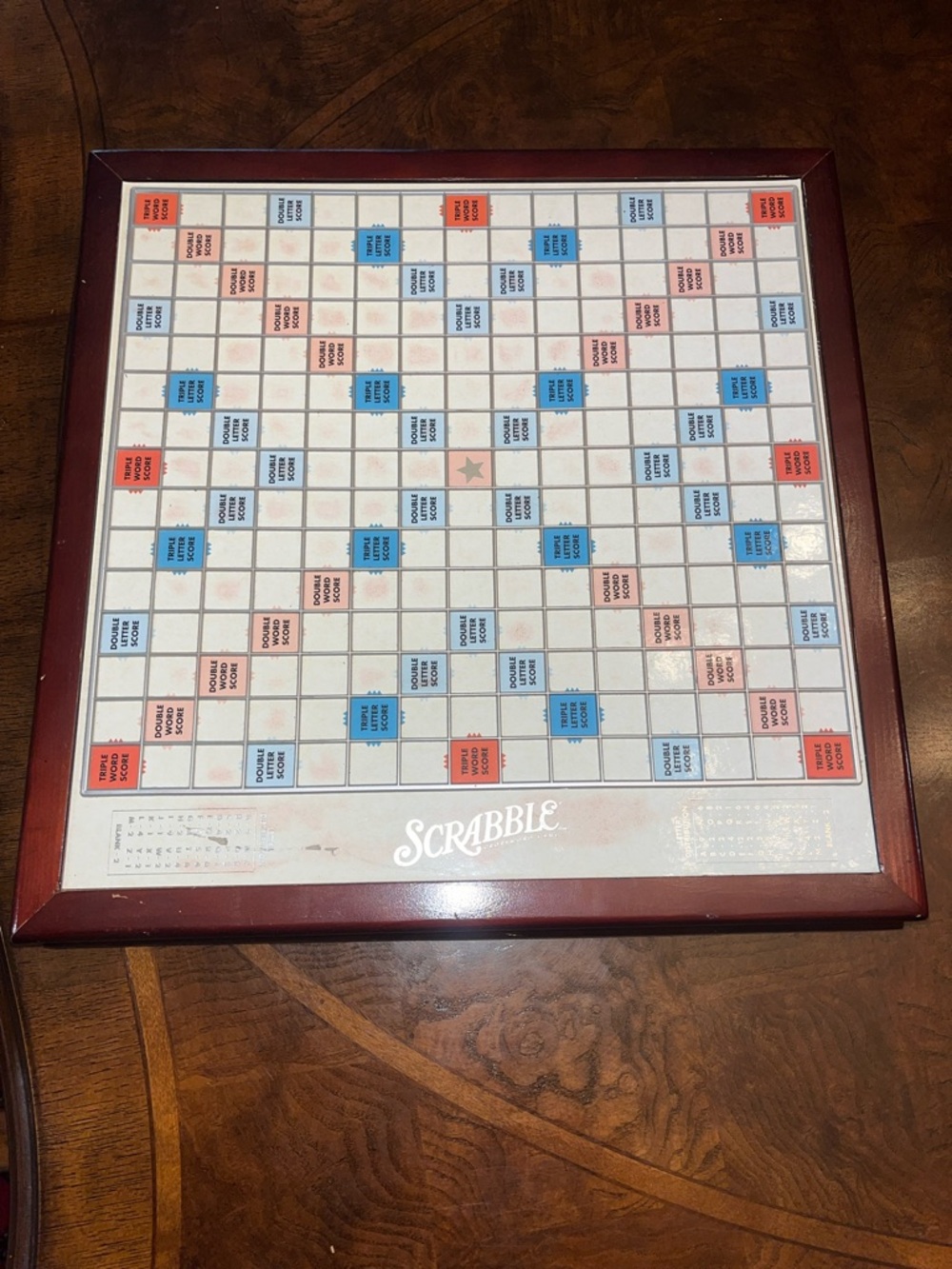 Scrabble Classic Game Board with Dark Red Frame on Turntable